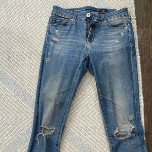 Size 25 AG skinny jeans with holes.